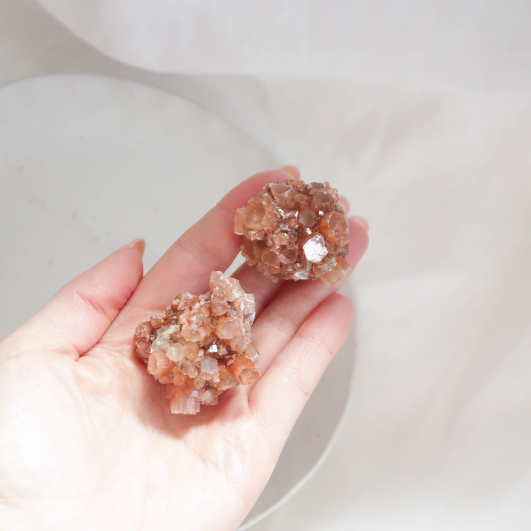 Two Small Raw Red Orange Aragonite Star Crystal Clusters