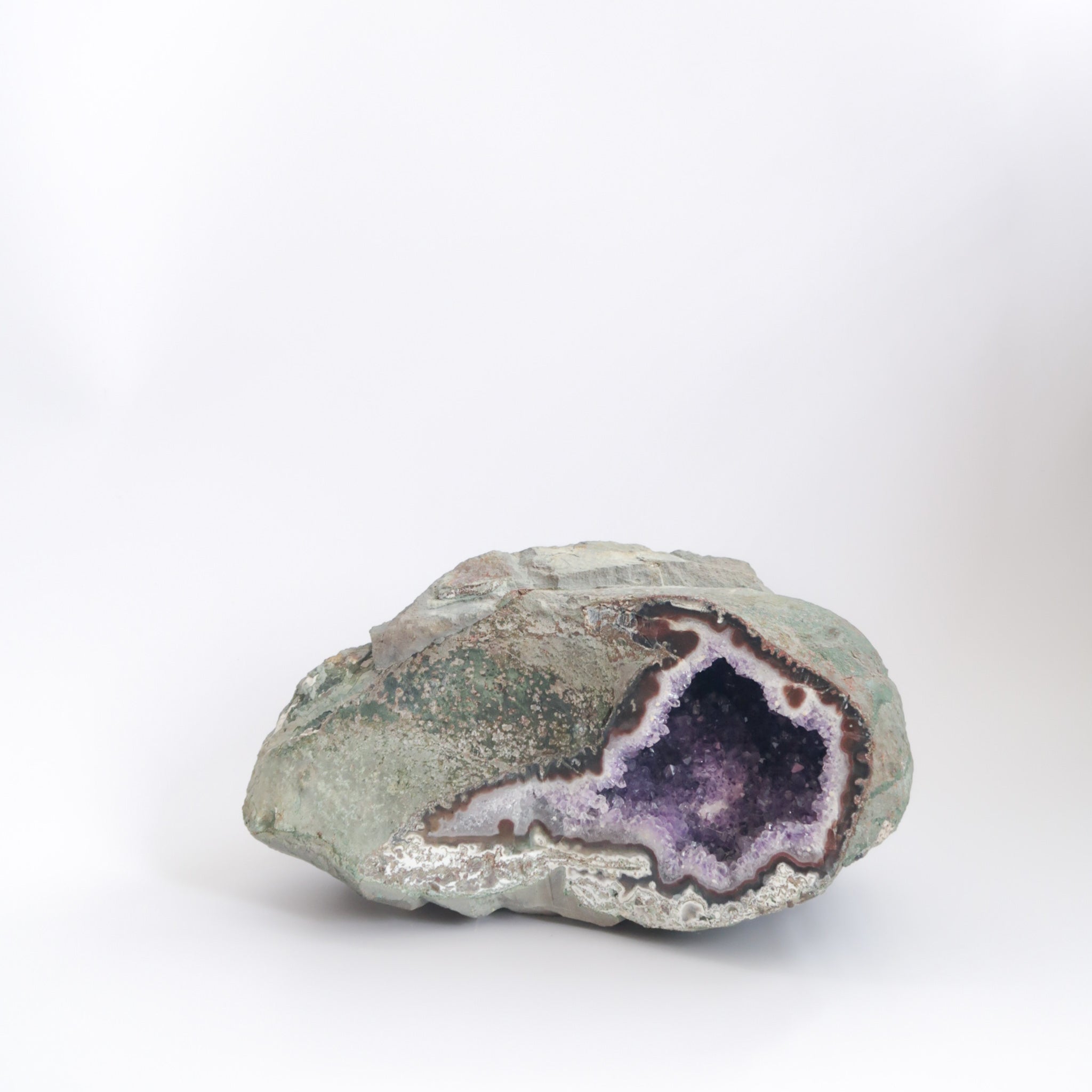 Large Natural and Raw Purple Amethyst Crystal Geode Right Side Opening with White Calcite Crystal Inclusion Inside