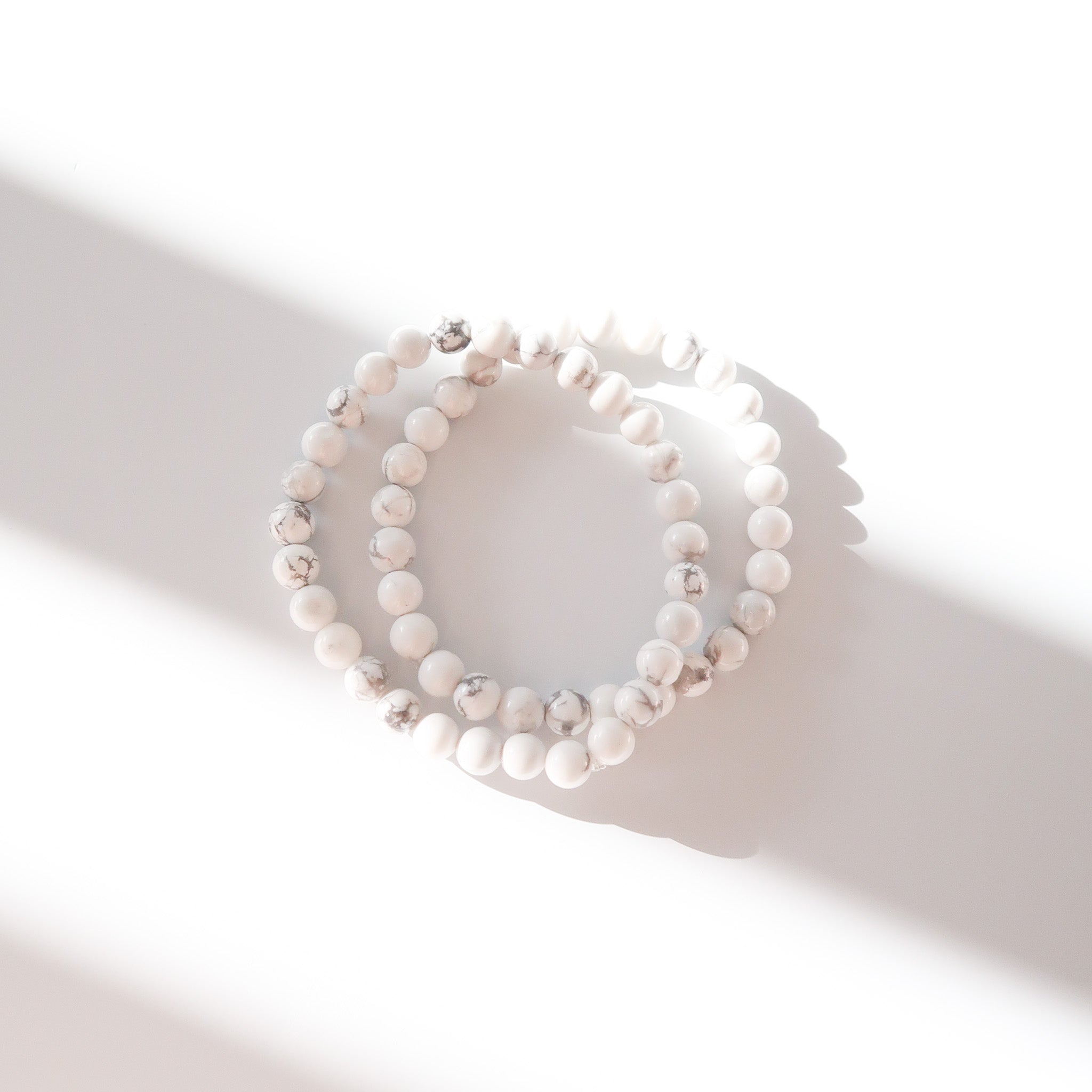 Polished Howlite Crystal Bracelets on a white background